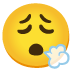 face exhaling emoji on Google